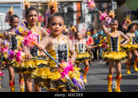 Elementary school girls taking part in a street procession as part of the Dinagyang festival celebrations,Iloilo,Philippines 2018 Stock Photo