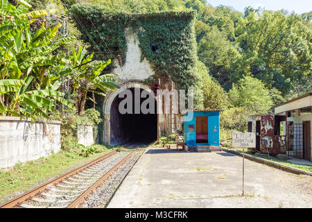 NEW ATHOS, ABKHAZIA, GEORGIA, 19 SEPTEMBER 2017: Railway tunnel in the mountain and the sign 'Stop! Forbidden Zone' near the Psirtskha Railway Station Stock Photo