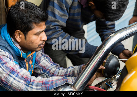 Gangtok, India, March 8 2017: Repair of the headlights on a car in Gangtok Stock Photo