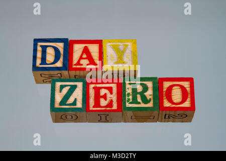 The phrase day zero displayed visually on a light background using colorful wooden toy blocks, image in landscape format with copy space Stock Photo