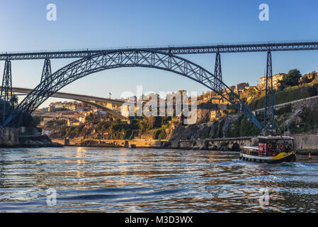 Old Maria Pia Bridge over Douro River between Porto and Vila Nova de Gaia city in Portugal. nfante Henrique Bridge on background Stock Photo