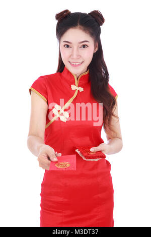 beautiful woman wearing cheongsam or qipao giving red envelopes in concept of happy chinese new year isolated on white background Stock Photo