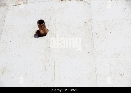Highly detailed steel pipes on a grunge concrete wall Stock Photo