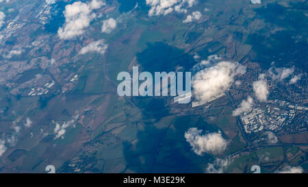 Aerial View of Green Fields and City with Wing turbines Stock Photo