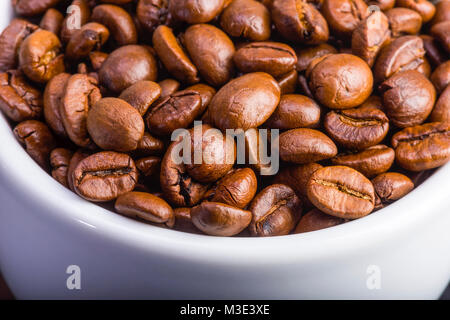 coffee beans in a white cup Stock Photo