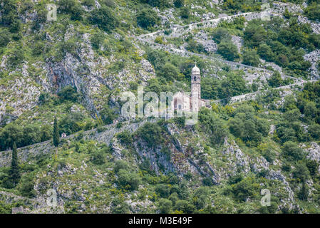 Church of Our Lady of Remedy and ancient fortress walls on the slope of Saint John mountain above Old Town of Kotor town in Bay of Kotor, Montenegro Stock Photo