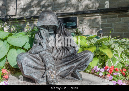 Ottawa, Ontario / Canada - June 29, 2010: When I Was Hungry and Thirsty by sculptor Timothy P. Schmalz sits in the garden at St. Andrew's Presbyterian Stock Photo