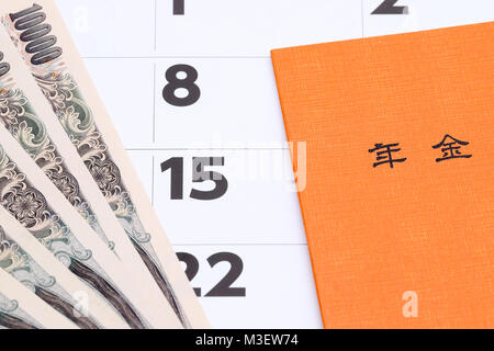 Japanese national pension plan handbook and money on calendar background Stock Photo