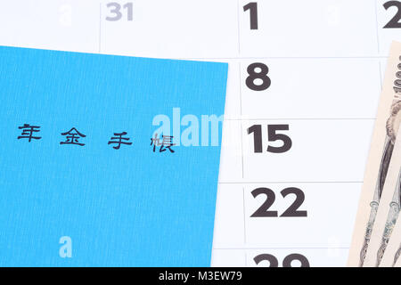 Japanese national pension plan handbook and money on calendar background Stock Photo