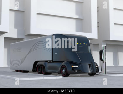 Black self-driving electric truck charging at charging station. 3D rendering image. Stock Photo