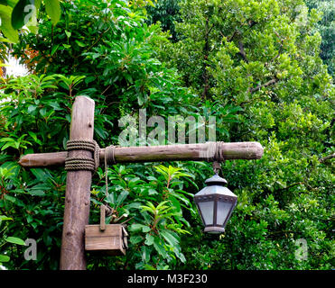 Rustic wooden street lamp post featuring modern led floodlight and ...