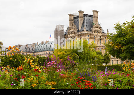 PARIS - JULY 15, 2014: Famous Tuileries garden (Jardin des Tuileries). Beautiful and popular public garden located between the Louvre Museum and the P Stock Photo