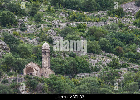 Church of Our Lady of Remedy and ancient fortress walls on the slope of Saint John mountain above Old Town of Kotor town in Bay of Kotor, Montenegro Stock Photo