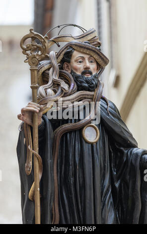 During the procession in Cocullo, the statue of San Domenico is covered with snakes. The wishes will be drawn from their position. Abruzzo, Italy. Stock Photo