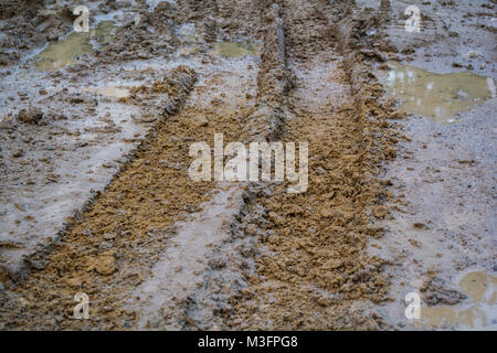 wheel tracks on rough road Stock Photo