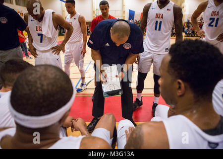 SHAPE, Belgium (Nov. 29, 2017) United States Armed Forces Basketball team head coach Army Captain Carl Little, from Norfolk, Virginia, goes over a play with his team at the Supreme Headquarters Allied Powers Europe (SHAPE) fitness center, during the final game of the 2017 SHAPE International Basketball Tournament. The annual event brings together teams from around the world for friendly competition and partnership at a prominent NATO installation (U.S. Navy Stock Photo