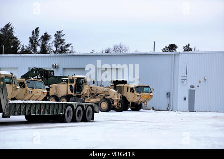 Army military vehicles are parked at a staging area Jan. 24, 2018, on the cantonment area at Fort McCoy, Wis. The vehicles were staged prior to being weighed and shipped by rail from the installation. (U.S. Army Stock Photo