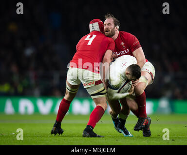 Twickenham, UK. 10th February, 2018: England's Jonny May is tackled by Wales's Alun Wyn Jones (r) and Cory Hill during the NatWest 6 Nations match at Twickenham Stadium, UK. Credit:Ashley Western/Alamy Live News Stock Photo