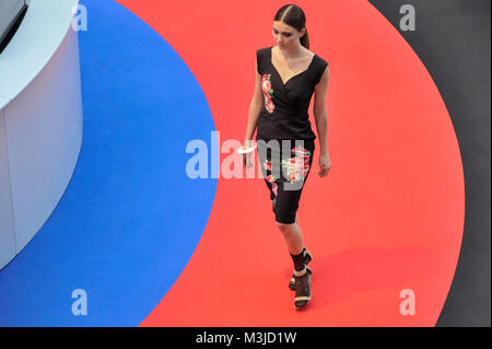 London, UK.  11 February 2018. A model on the Future Stage catwalk. Pure London, the UK's largest trade buying fashion event for womenswear, menswear, footwear and accessories from emerging and established designers, opens at Kensington Olympia showcasing the latest trends for AW18/19.  Credit: Stephen Chung / Alamy Live News