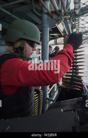 GULF OF THAILAND (Feb. 9, 2018) Gunner's Mate Seaman Bianca Yorga, from Vista, Calif., loads a .50-caliber machine gun during small craft action team (SCAT) training aboard the amphibious assault ship USS Bonhomme Richard (LHD 6). Bonhomme Richard is operating in the Indo-Asia-Pacific region as part of a regularly scheduled patrol and provides a rapid-response capability in the event of a regional contingency or natural disaster. (U.S. Navy Stock Photo
