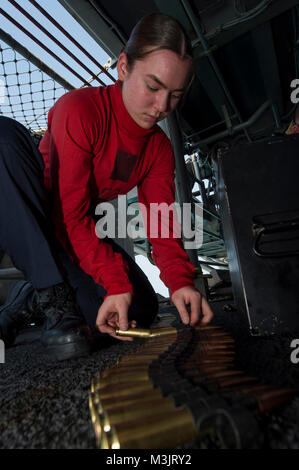 GULF OF THAILAND (Feb. 9, 2018) Gunner's Mate Seaman Bianca Yorga, center, from Vista, Calif., connects rounds of .50-caliber machine gun ammunition during small craft action team (SCAT) training aboard the amphibious assault ship USS Bonhomme Richard (LHD 6). Bonhomme Richard is operating in the Indo-Asia-Pacific region as part of a regularly scheduled patrol and provides a rapid-response capability in the event of a regional contingency or natural disaster. (U.S. Navy Stock Photo