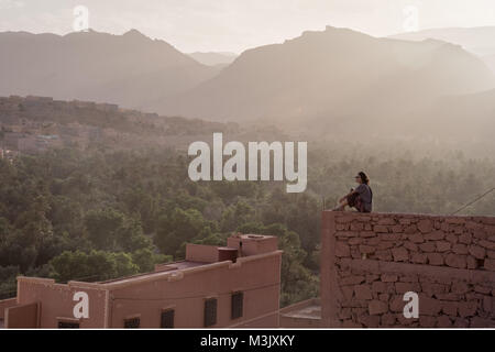 Asian young woman looking out views scenic Todra Gorge Morocco Stock Photo