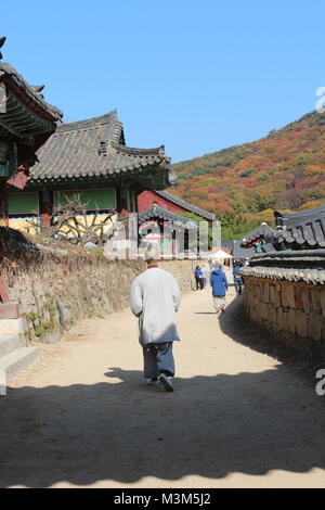 Busan, South Korea - November 9, 2017: A monk and tourists walking around at the Beomeosa Temple in autumn Stock Photo