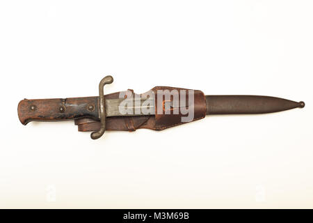Close up view of vintage bayonet in scabbard aganist white background Stock Photo