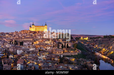 Panoramic view of the medieval center of the city of Toledo, Spain. It features the Tejo river, the Cathedral and Alcázar of Toledo. Stock Photo
