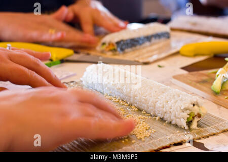 Japanese sushi and rolls with a salmon, avocado, cucumber and flying fish caviar Stock Photo