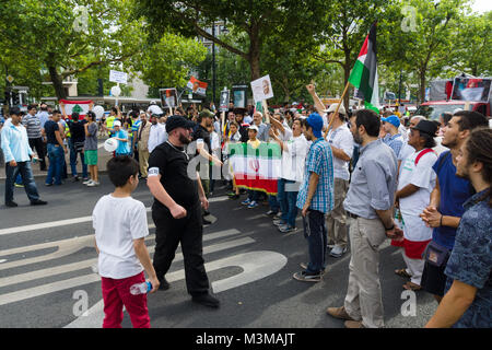 BERLIN, GERMANY - AUGUST 03, 2013: International Quds Day. Demonstrators on the Kurfuerstendamm. Stock Photo