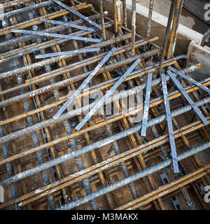 Reinforcement bars and punching shear rails of an RC slab in a construction site. Squared format. Stock Photo