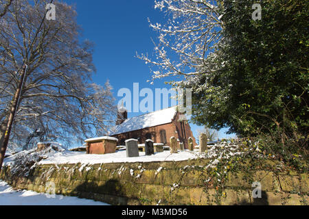 Village of Coddington, England. Picturesque winter view of the 19th century St Mary’s Church, in the Cheshire village of Coddington. Stock Photo