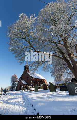 Village of Coddington, England. Picturesque winter view of the 19th century St Mary’s Church, in the Cheshire village of Coddington. Stock Photo