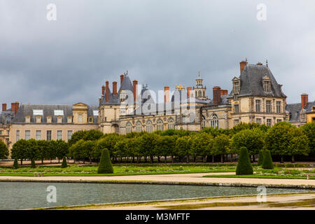 Royal hunting castle Fontainbleau. Palace of Fontainebleau - one of largest royal chateaux in France (55 km from Paris), UNESCO World Heritage Site. Stock Photo