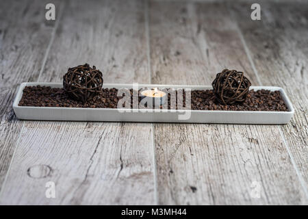 Beautiful and discreet decoration for nice moments on a wooden table. Stock Photo
