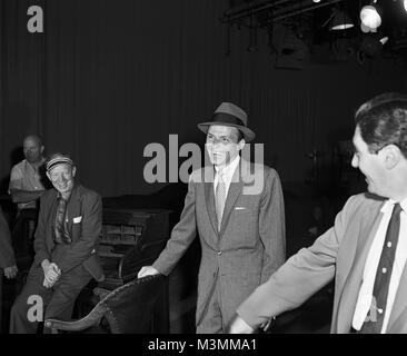 Frank Sinatra on the set of “Our Town”, 1955. Sinatra played the Stage Manager in this musical adaption of the Thornton Wilder play.  In this production, he introduced his well-known signature song, Love and Marriage. Original camera negative. Stock Photo