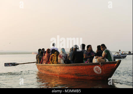 Visitors and tourists on boats on the river Ganges in Varanasi in india Stock Photo