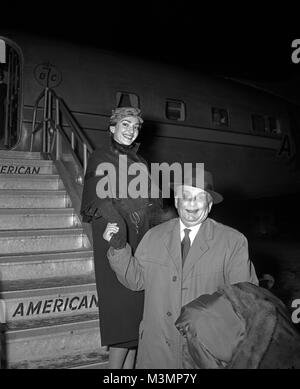 Diva, Maria Callas, opera singer, arriving at Chicago Midway Airport with her husband Giovanni Battista. January 12th, 1957. Original camera negative. Stock Photo