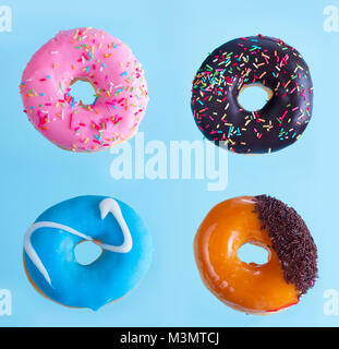 flying doughnuts on blue Stock Photo