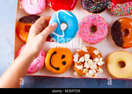 sweet doughnuts on gray stone background Stock Photo