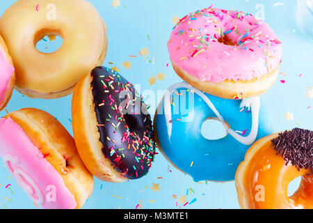 flying doughnuts on blue Stock Photo