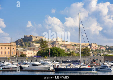 Milazzo, Italy - August 22, 2017: View of the port in Sicilian town with Milazzo Castle in the background Stock Photo