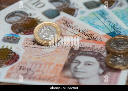 New UK currency, 10 pounds, 5 ponds, 1 pound coins Stock Photo