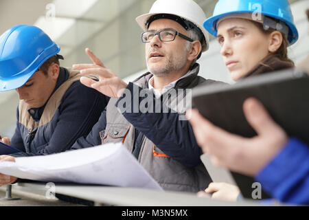 Instructor with young people in engineering training Stock Photo
