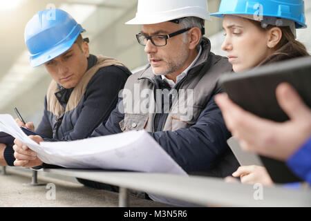 Instructor with young people in engineering training Stock Photo
