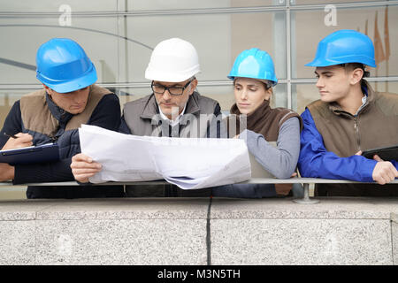 Instructor with young people in engineering training Stock Photo
