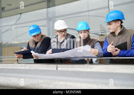 Instructor with young people in engineering training Stock Photo