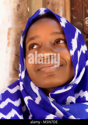 Young Muslim woman in Zanzibar's Stone Town. Stock Photo