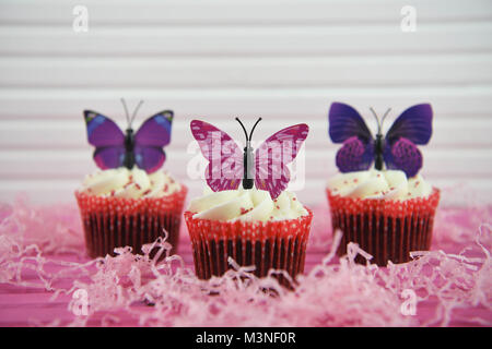 springtime with food of delicious homemade cupcakes decorated with butterflies Stock Photo